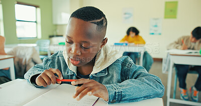 Buy stock photo Reading, education and quiz with boy in classroom for test, child development and knowledge. Studying, assessment and academy with student on school campus for learning, course curriculum and exam