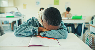 Buy stock photo Tired, kid and student sleeping in classroom for education, learning fatigue and boring lesson. Exhausted, child and nap on desk from study burnout, school pressure and overworked with academic exams