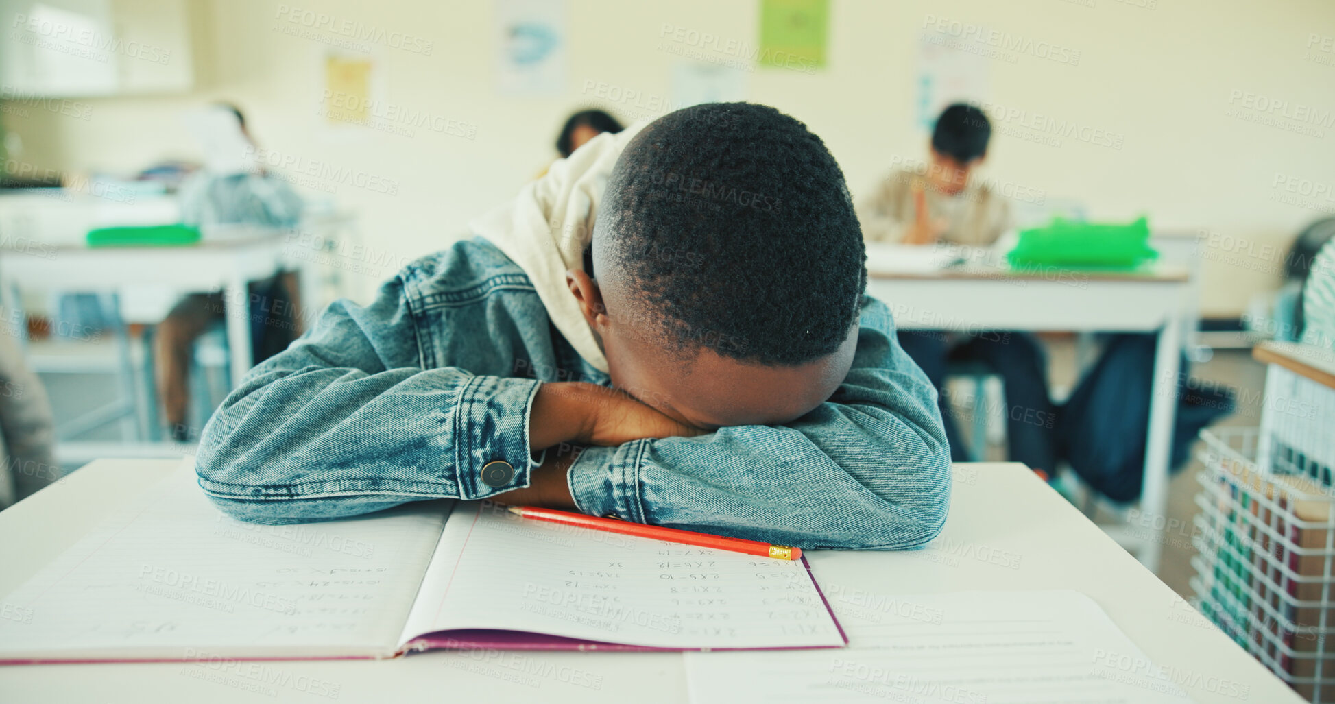 Buy stock photo Tired, kid and student sleeping in classroom for education, learning fatigue and boring lesson. Exhausted, child and nap on desk from study burnout, school pressure and overworked with academic exams