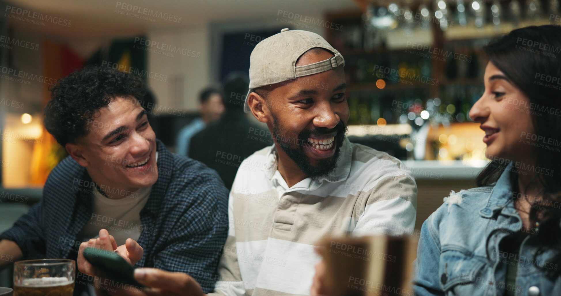 Buy stock photo Happy, friends and sports betting with smartphone, pub or online competition for football tournament. Laughing, woman and men with mobile for entertainment, conversation and gambling for soccer match