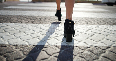 Buy stock photo Back, walking and woman in city, high heels and travel with morning commute. Closeup, person and professional in street, shoes or comfort with journey, adventure and trip with location or destination