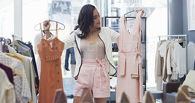 Buy stock photo Fashion, shopping and woman with clothes for choice, decision and bargain on Black Friday. Retail store, person and customer in boutique for sale, discount and outfit option with promotion for deal