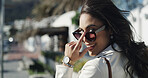 Portrait, smile and sunglasses with woman outdoor for commute, fashion or travel on sidewalk. Back, eyewear style or walking and happy person with attitude in city for break, satisfaction or trip