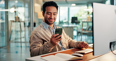 Buy stock photo Design, phone and text message with business man at desk in office for development or update. App, computer and typing with designer in creative workplace for communication or online planning