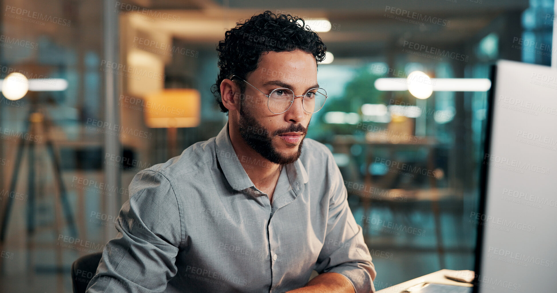 Buy stock photo Research, feedback and man with computer in office for creative project, evening and online article. Glasses, reading and magazine editor with deadline, overtime or review for publishing on tech