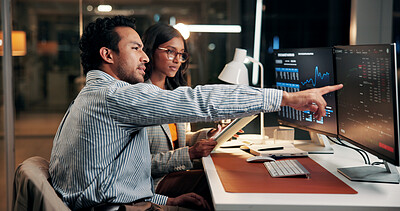 Buy stock photo Pointing, talking and business people on computer at night for finance review, investment and budget report. Office, working late and workers on tech for financial analytics, research or stock market