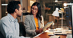 Night, talking and business people on tablet for finance review, investment and budget planning. Meeting, working late and man with woman on tech for financial report, research and proposal in office