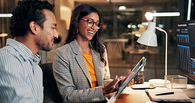 Buy stock photo Night, meeting and happy business people on tablet for finance review, investment and budget planning. Office, working late and man with woman on tech for financial report, research and stock market