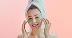 Portrait, skincare or happy woman with eye mask in studio, reduce dark circles or mockup space. Smile, hydration or person with facial patches for dermatology, self care treatment or pink background