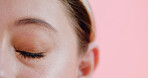 Mascara, eyelashes and woman in studio for cosmetics, volume and length boost in eye prep. Beauty, closeup and female person on pink background with mockup, natural and lash lift in makeup results