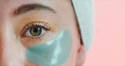 Buy stock photo Portrait, skincare or eye with mask in studio, reduce dark circles or hydration treatment for wellness. Space, anti aging benefits or woman with patch for dermatology, closeup or pink background
