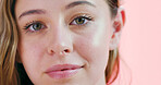 Portrait, glow and woman with makeup, studio and pride with eyelash extension, beauty and cosmetics. Confident, person and self care with facial enhancement, pink background and foundation for face