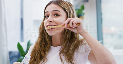 Buy stock photo Woman, hygiene or brushing teeth in home with toothpaste for morning routine, dental care or wellness. Female person, toothbrush or getting ready in bathroom with oral health, clean and fresh breath.