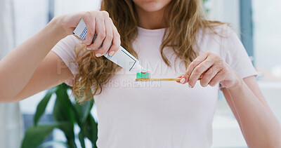 Buy stock photo Woman, hands and toothbrush in bathroom with toothpaste for morning routine, dental hygiene or wellness. Female person, brushing teeth and getting ready in home for oral care, clean and fresh breath.