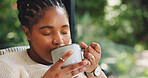 Coffee, relax and black woman in home with ideas, reflection or positive memory in morning. Cappuccino, happy and African female person with drinking latte and thinking or planning in living room