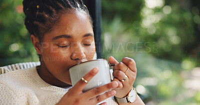 Buy stock photo Coffee, relax and black woman in home with calm, peace or positive memory in morning. Cappuccino, happy and African female person with drinking latte and bokeh with space in living room for break