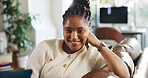Portrait, smile and black woman in living room for relax, peace and calm on weekend break in home. Confidence, comfort and African person on sofa in apartment for chill, wellness and happy in Kenya