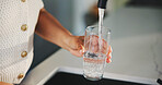 Glass, water and tap with hands of woman in kitchen for detox drinks, mineral hydration and health in home. Electrolytes, wellness and aqua with person for faucet, liquid or beverage in apartment