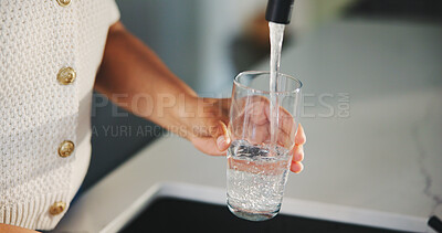 Buy stock photo Glass, water and tap with hands of woman in kitchen for detox drinks, mineral hydration and health in home. Electrolytes, wellness and aqua with person for faucet, liquid or beverage in apartment
