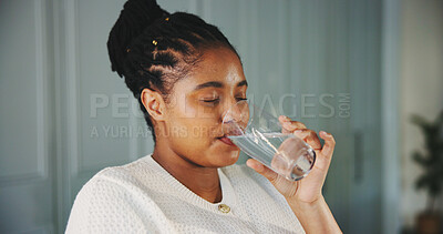 Buy stock photo Glass, water and drinking with black woman in kitchen for detox, mineral hydration and health in home. Electrolytes, wellness and aqua with african person for clean, liquid or beverage in apartment