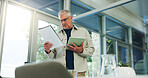 Mature, businessman and documents with tablet in office for company policy, review or proposal. Man, CEO or executive reading with project brief or technology for business ideas, agenda or tasks