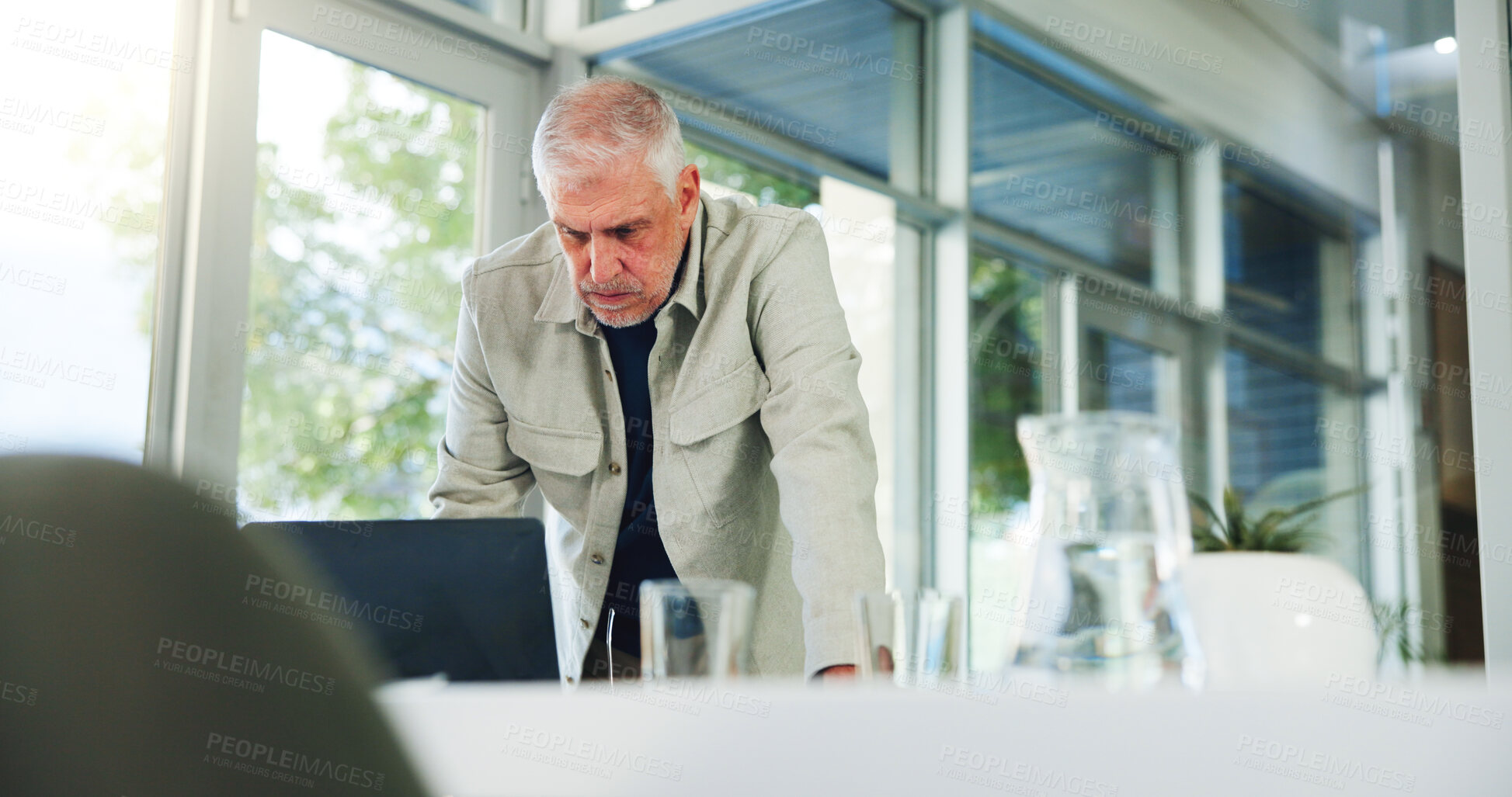 Buy stock photo Laptop, reading and serious with man in office for planning, problem solving or research as editor. Computer, publication and review with mature employee at desk in workplace for online magazine