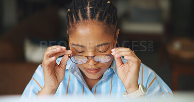 Buy stock photo Reading, glasses or black woman in office with tech, eyewear check or better vision for proofreading. Review, adjustment or journalist in agency with specs, draft edit or clear eye sight in research.