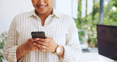 Buy stock photo Typing, hands or woman in agency with phone, news update or online communication on social media. Smile, texting or employee in office with tech, internet browse and connection on email app.