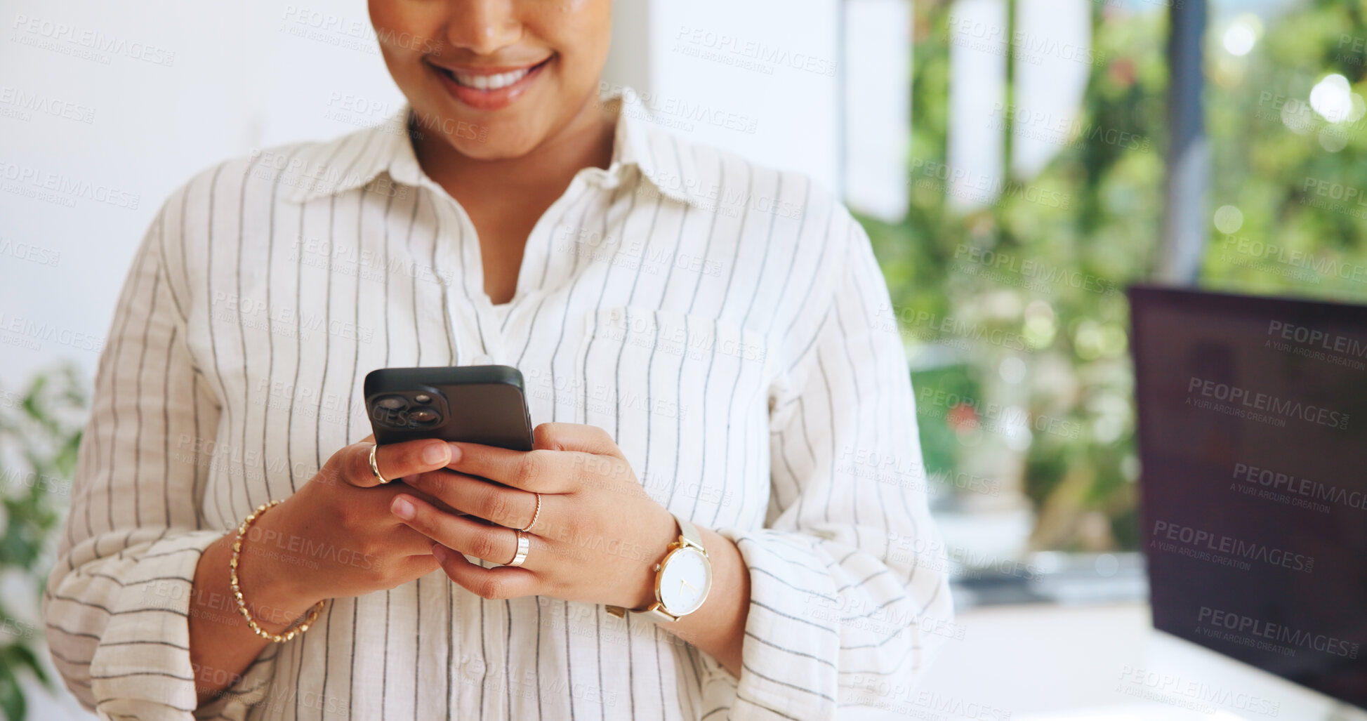 Buy stock photo Typing, hands or woman in agency with phone, news update or online communication on social media. Smile, texting or employee in office with tech, internet browse and connection on email app.