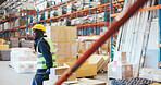 Boxes, radio and trolley with black man in storage depot with distribution or shipping. Communication, logistics and stock with African employee in supply chain plant for import or export delivery