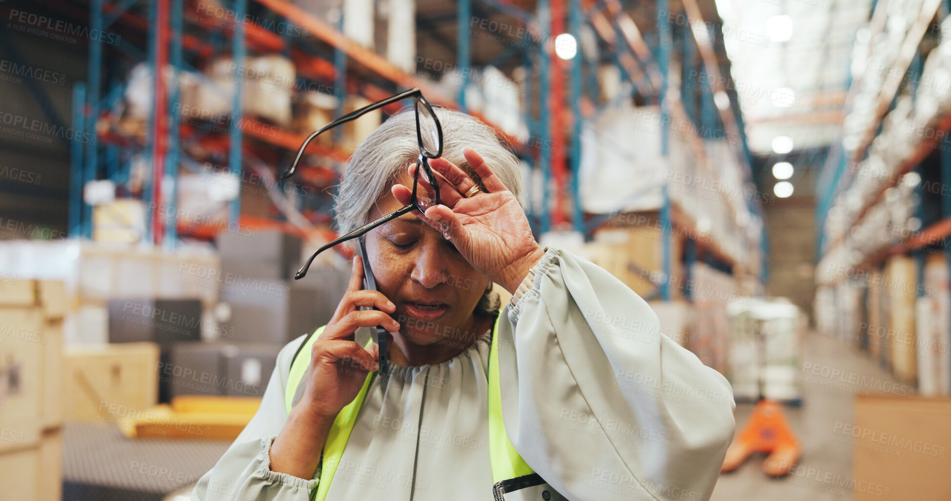 Buy stock photo Warehouse, logistics and woman with stress, phone call or discussion with contact for delivery delay. Factory, supervisor and mature person with anxiety for distribution fail, mobile and supply chain