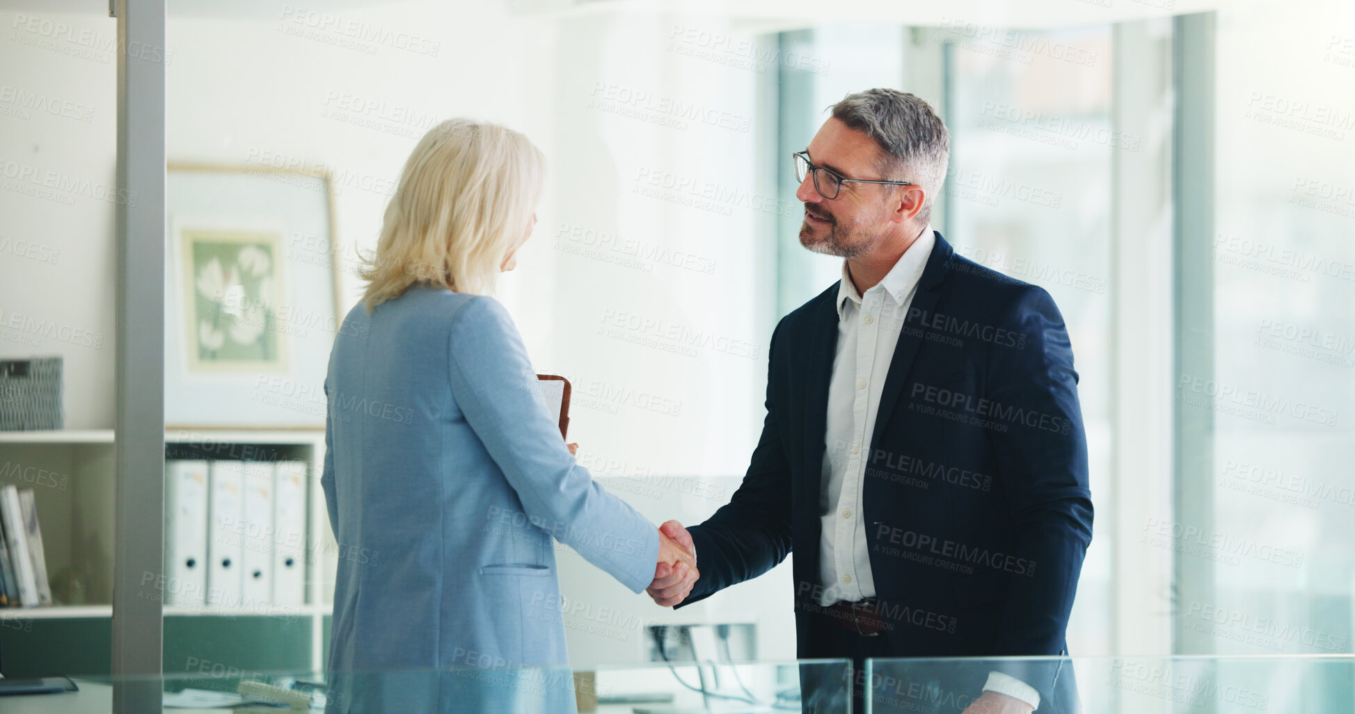 Buy stock photo Handshake, partnership and business people in office with deal, finance contract or greeting. Welcome, negotiation and financial manager shaking hands with client for investment proposal in workplace