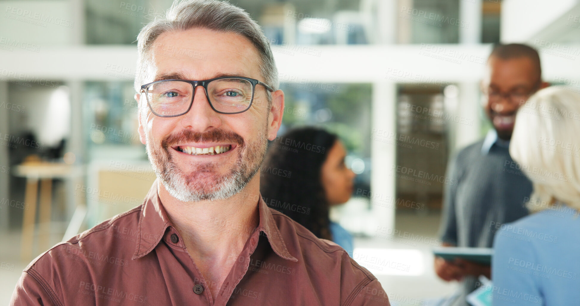 Buy stock photo Company, portrait and smile of man with colleagues in office for about us, ambition or development. Business, glasses or satisfaction and mature employee person in workplace with team for workshop