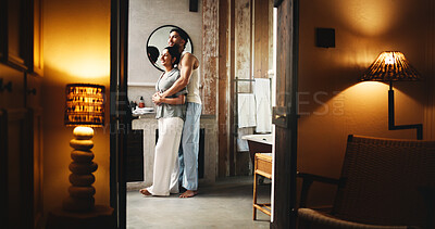 Buy stock photo Couple, hug and smile in bathroom for self care, grooming routine and caring relationship in home. Connection, love and people for support in apartment with night, hygiene or getting ready for bed