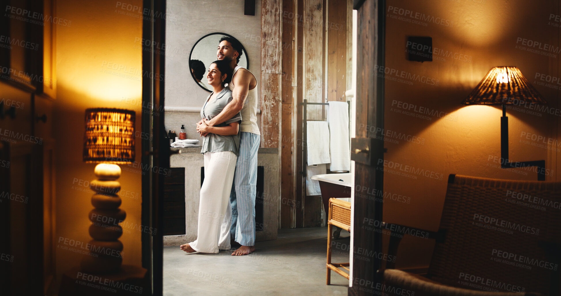 Buy stock photo Couple, hug and smile in bathroom for self care, grooming routine and caring relationship in home. Connection, love and people for support in apartment with night, hygiene or getting ready for bed