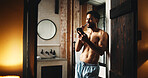 Phone, brushing teeth and man in home for dental wellness, hygiene and morning news. Mobile, cleaning tooth and shirtless person by bathroom doorway for oral care, health and reading message online