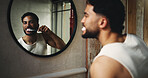 Happy man, mirror or brushing teeth with reflection in bathroom for dental hygiene or fresh breathe. Male person, cleaning and grooming with toothbrush in home for oral healthcare or morning routine