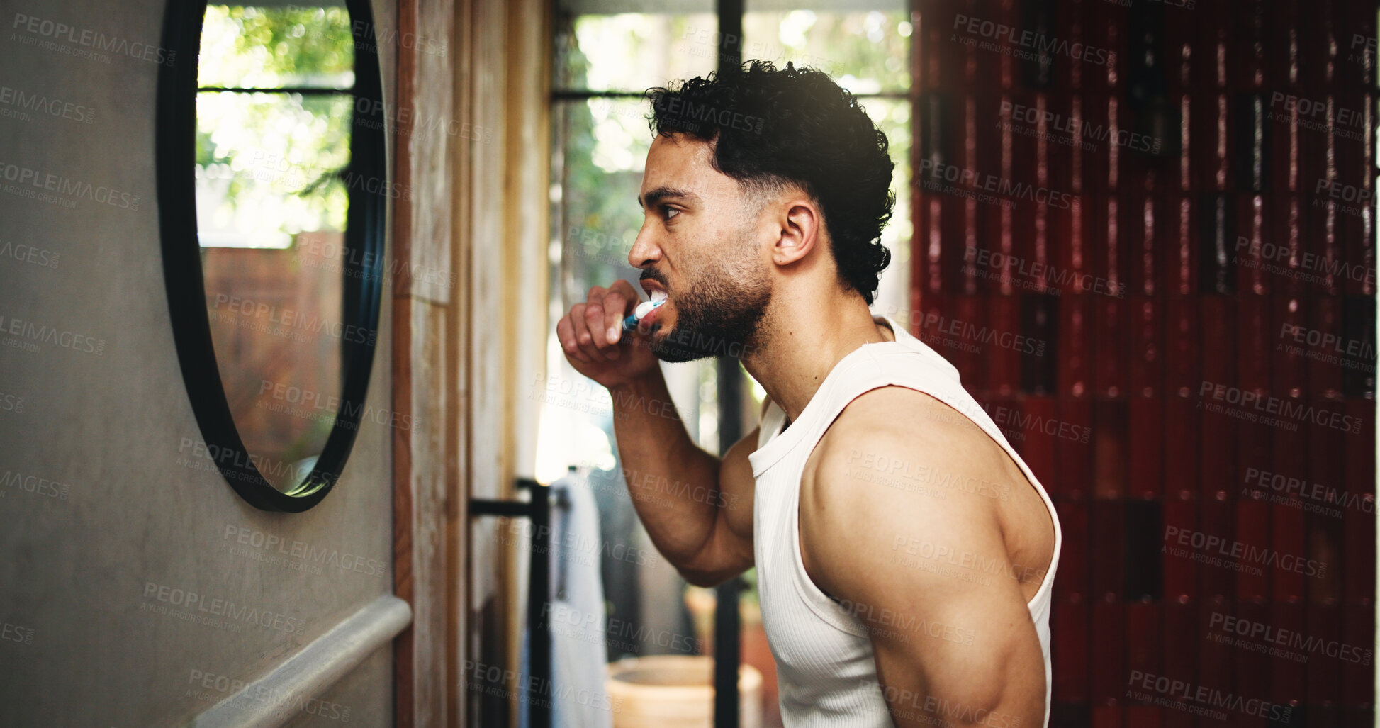 Buy stock photo Man, morning and brushing teeth with mirror in bathroom for dental hygiene or fresh breath in home. Profile, male person or cleaning mouth with toothbrush for grooming, oral or gum care in house