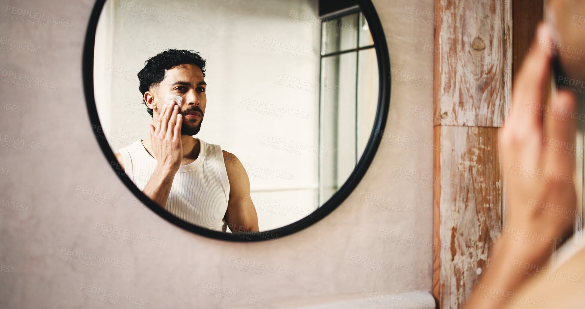 Buy stock photo Man, skincare or moisturizer with mirror in bathroom for morning routine or cosmetics in home. Male person, reflection or cleaning with lotion, face cream or facial treatment for smooth skin in house