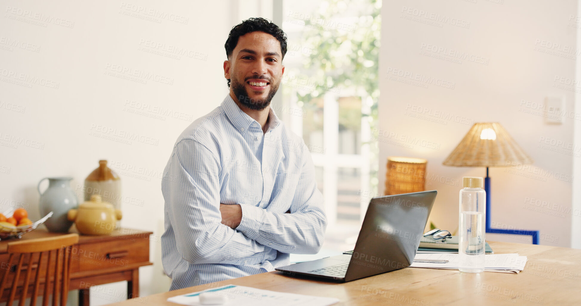 Buy stock photo Arms crossed, laptop and portrait of business man in home office for online planning or research. Computer, remote work and smile of happy freelance employee at desk in apartment for startup career