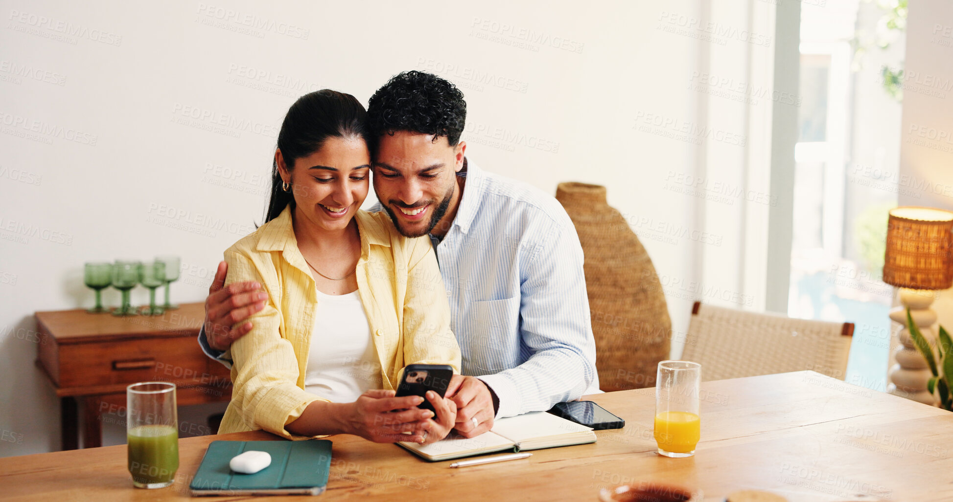 Buy stock photo Happy, hug and couple with phone in home for online booking, holiday resort and travel website. Apartment, love and man with woman on smartphone for hotel reviews, planning vacation and research