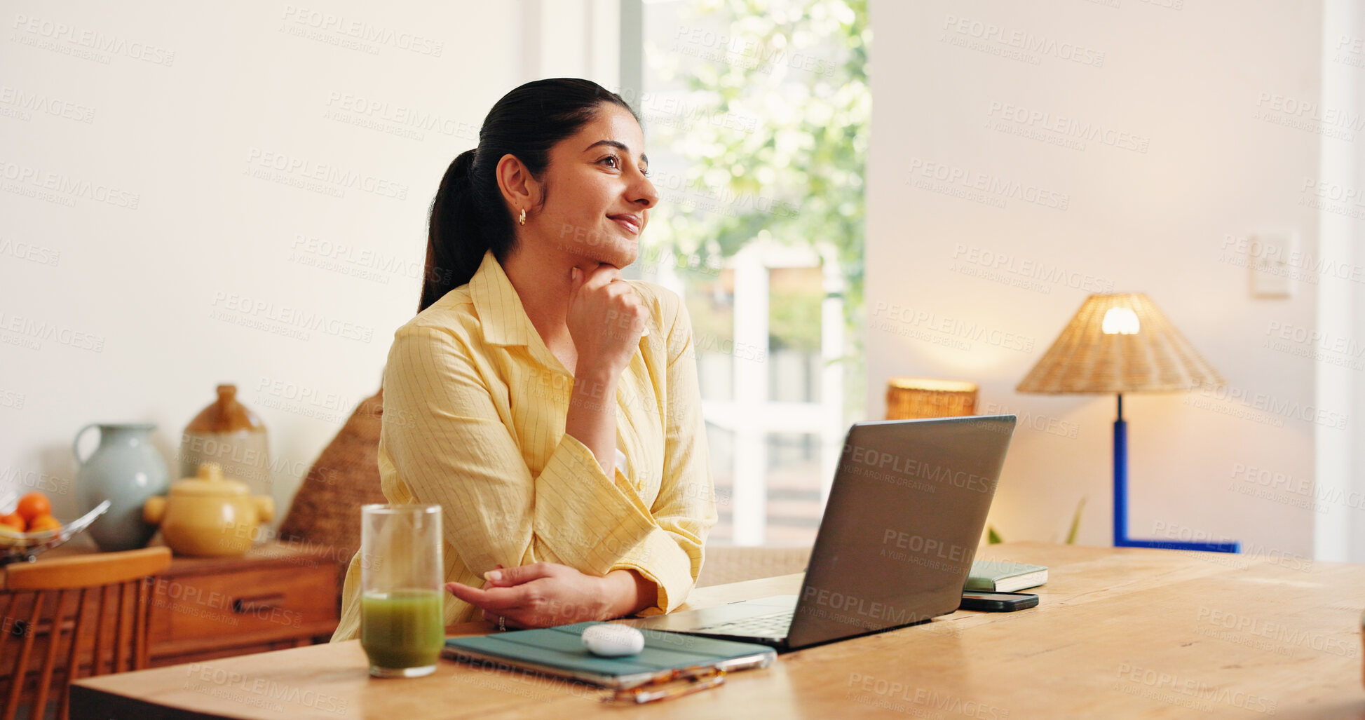 Buy stock photo Laptop, smile and thinking with business woman in home office for online solution or research. Computer, planning and remote work with happy Indian employee at desk in apartment as startup freelancer