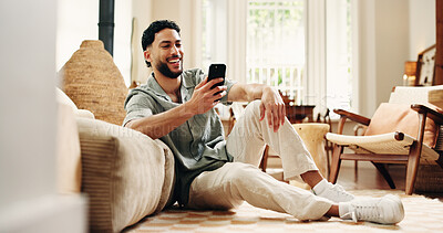 Buy stock photo Man, laugh and scroll with phone in home for funny social media video, online dating and virtual chat. Happy, person and browsing in house with tech for text message, internet  humor and mobile app.