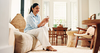 Buy stock photo Woman, laugh and scroll with phone on sofa for funny social media video, online dating and virtual chat. Happy, person and browsing in home with tech for text message, internet  humor and mobile app.