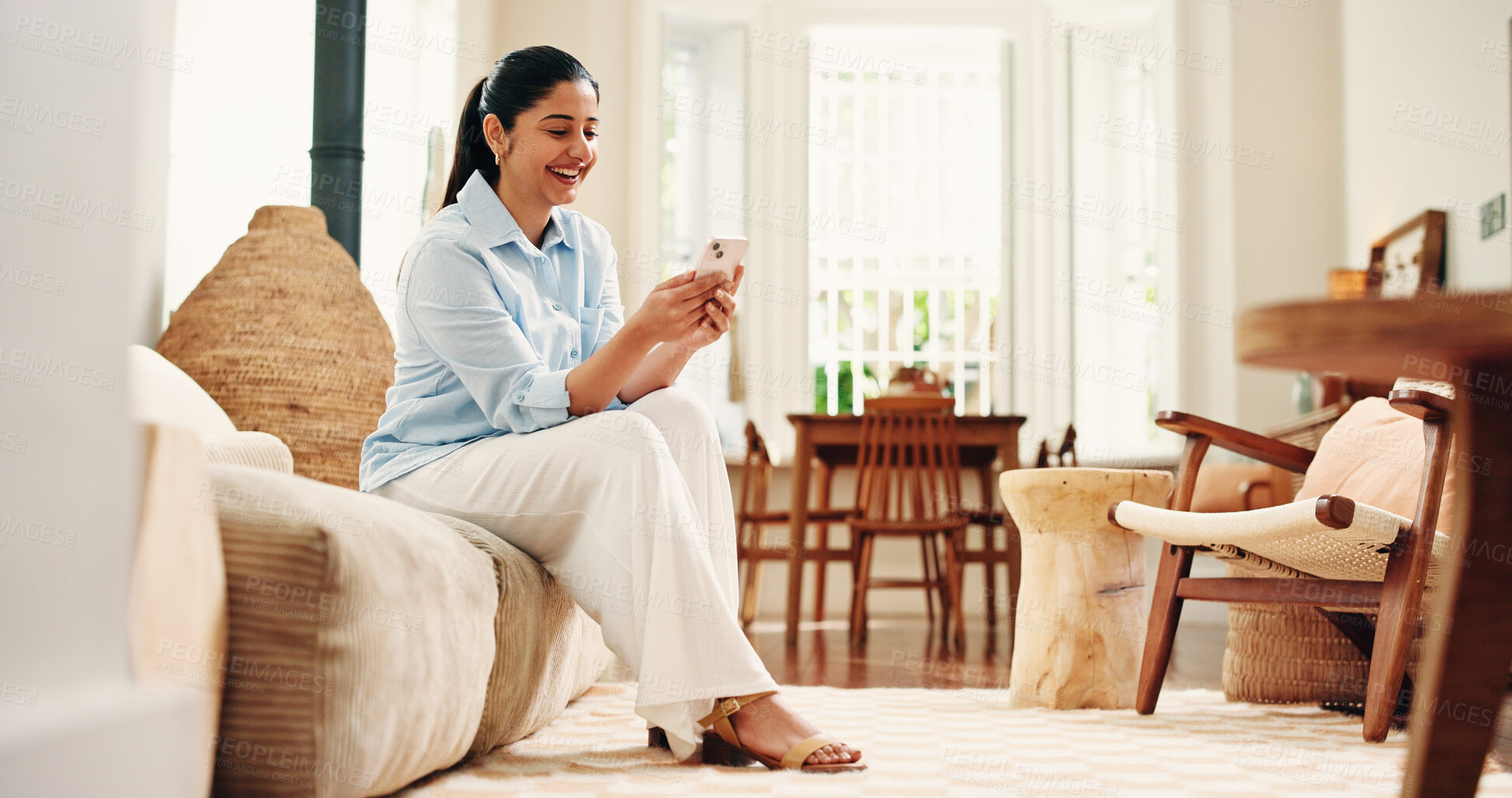 Buy stock photo Woman, laugh and scroll with phone on sofa for funny social media video, online dating and virtual chat. Happy, person and browsing in home with tech for text message, internet  humor and mobile app.