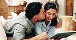 Tablet, hug and couple with kiss on couch to watch movies, online subscription or website for bonding. Love, romantic home date and happy people relax with support, streaming film together or tech