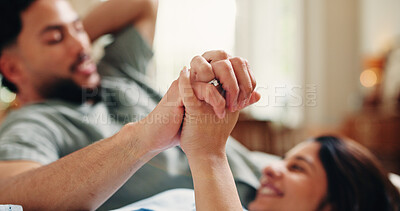 Buy stock photo Relax, holding hands and love with couple on sofa of home for connection, romance or bonding. Support, happy and trust with man and woman in living room of apartment for commitment, marriage and care