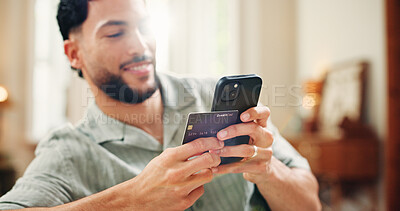 Buy stock photo Credit card, smile or man on sofa with phone, online banking or payment in eft transaction. Flare, easy purchase or male person at house with tech, remote or debit details for cashless service.