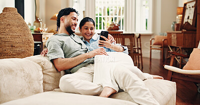 Buy stock photo Couple, phone and relax on couch, laugh and scroll for funny video, bonding or post in living room at house. Happy woman, man and smartphone with mobile app, chat or meme on social media at apartment