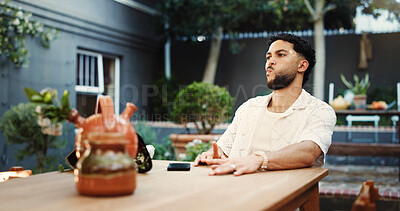 Buy stock photo Frustrated, man and waiting with delay, restaurant and annoyed by late date, valentines day or roses. Diner, reservation and person with bouquet for anniversary, angry or upset with appointment